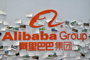 Logo of Alibaba Group is shown with several notes posted around it.