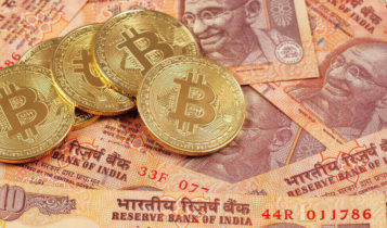 Close-up of Bitcoin with Indian rupee notes