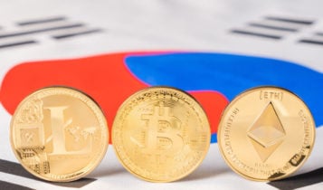 litecoin, bitcoin, and ethereum in a form of coins are standing on the flag of South Korea