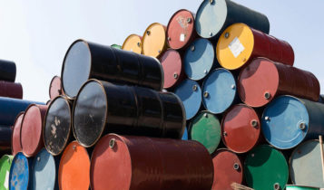 different colors of oil barrels stacked on each other.