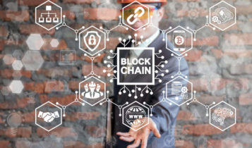 a man on the background showing a blockchain concept on his palm