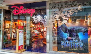 disney store and a black panther poster posted on the window