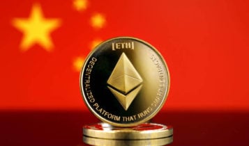 an ethereum coin standing on 2 coins and the flag of china on the background