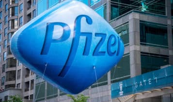 a blue balloon with the pfizer logo on it